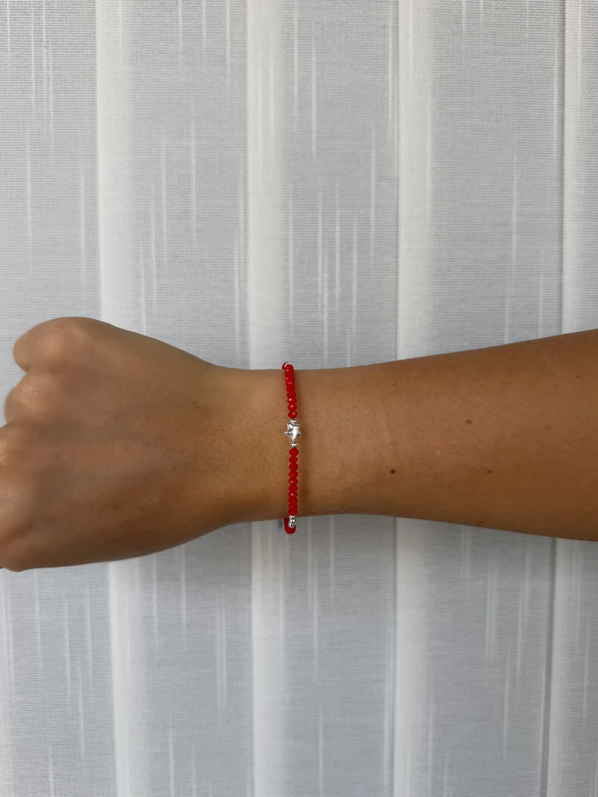 Pulsera roja estrella